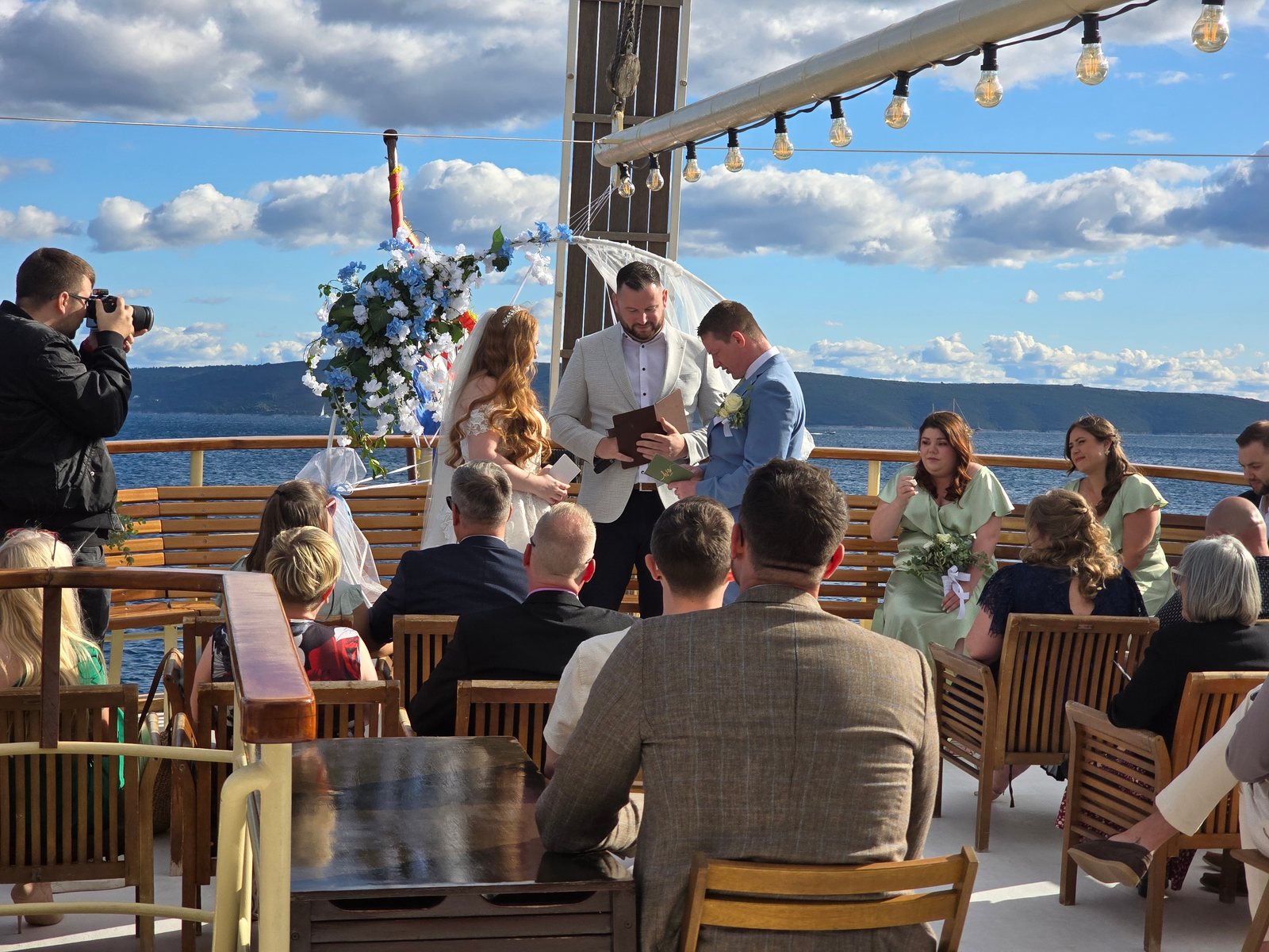 A wedding celebration on the deck of the yacht Polaris