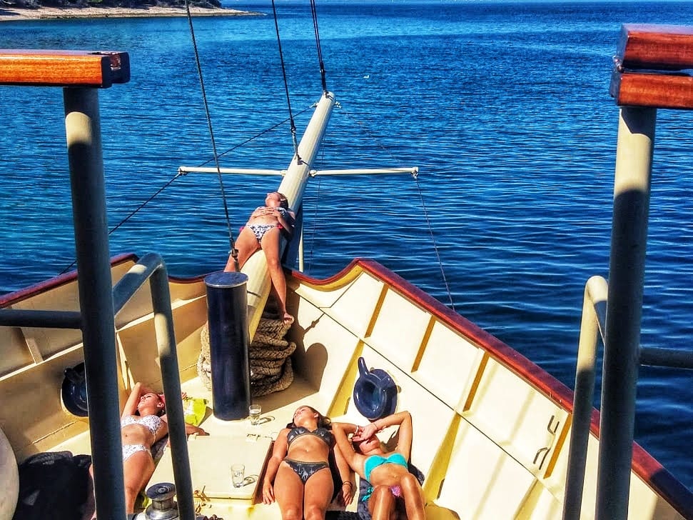 Guests sunbathing on the bow of Polaris