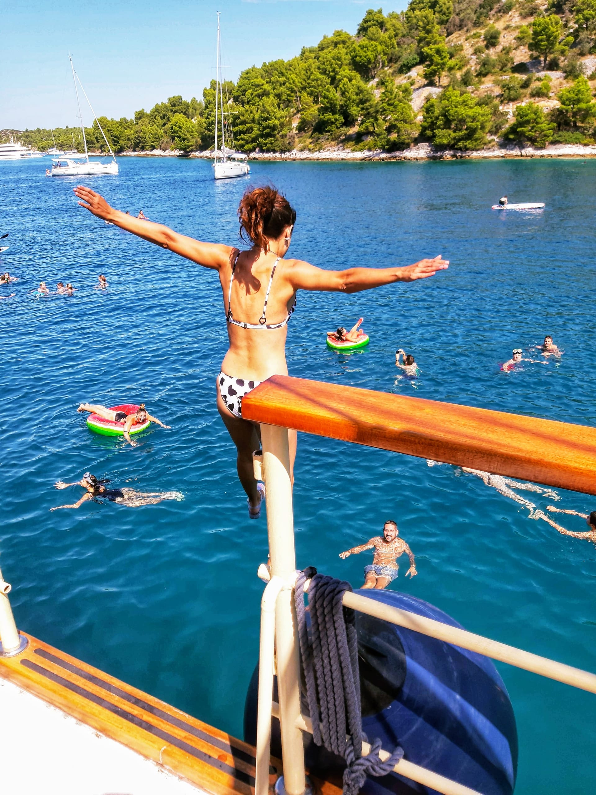 Guest leaping off the rail into the Adriatic